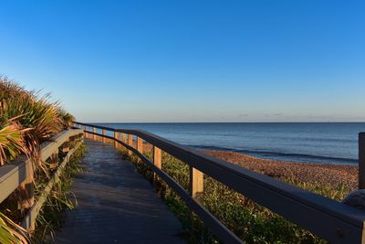 Scenic view of sea against clear blue sky