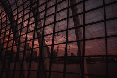 Low angle view of glass window at night