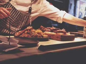 Man preparing food on table