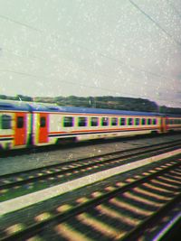 Train on railroad track against sky