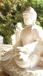 Close-up of buddha statue at temple