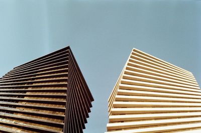 Low angle view of modern building against clear sky