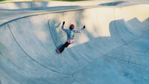 High angle view of woman skateboarding