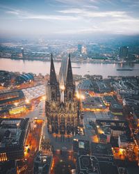 High angle view of city lit up at dusk