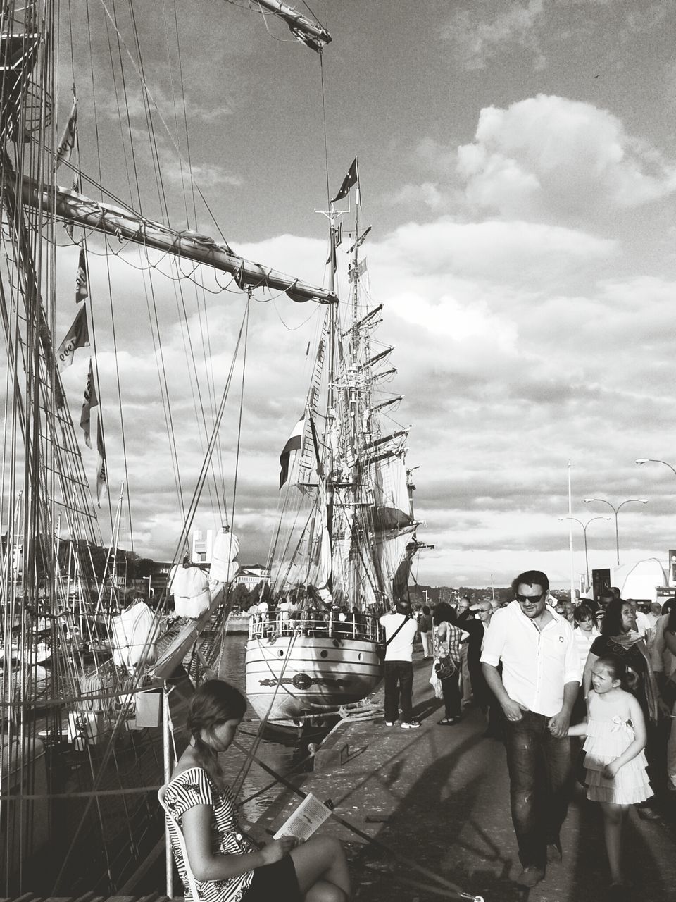 water, sky, leisure activity, lifestyles, nautical vessel, men, transportation, sea, mode of transport, cloud - sky, boat, moored, day, harbor, person, outdoors, mast, standing