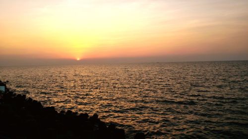 Scenic view of sea at sunset