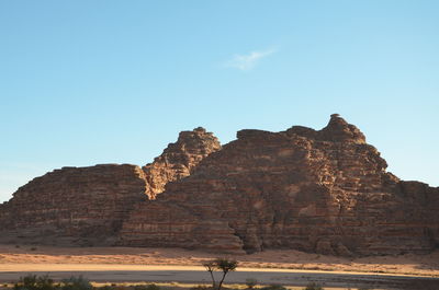 Rock formations against clear blue sky