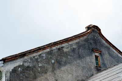 Low angle view of old building against sky