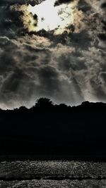 Scenic view of lake against sky at sunset