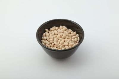 High angle view of eggs in bowl against white background