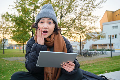 Young woman using digital tablet