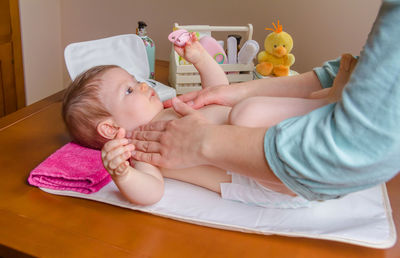 Cute baby boy lying on bed