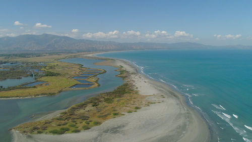 Aerial view of sandy beach lingayen with azure water on the island luzon, philippines. 