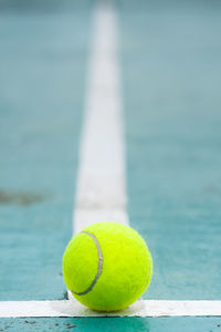 Close-up of tennis ball on court