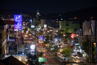 High angle view of illuminated city street at night