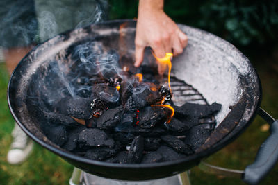 Low section of people holding fire