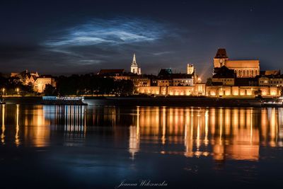 Illuminated buildings at waterfront