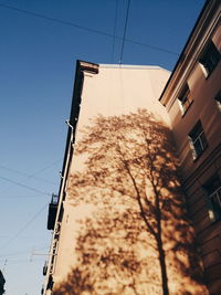 Low angle view of buildings against clear sky