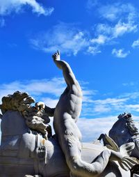 Low angle view of statue against sky