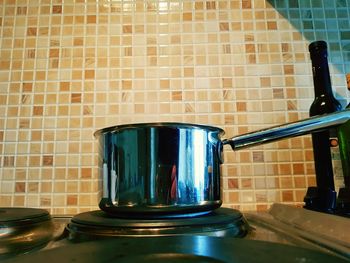 Close-up of kitchen utensils on wall at home