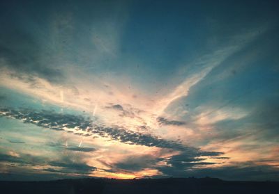 Scenic view of landscape against cloudy sky