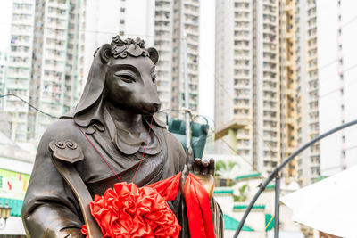 Low angle view of statue against building