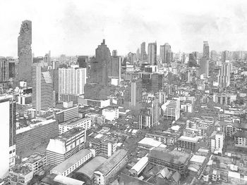 High angle view of city buildings against sky