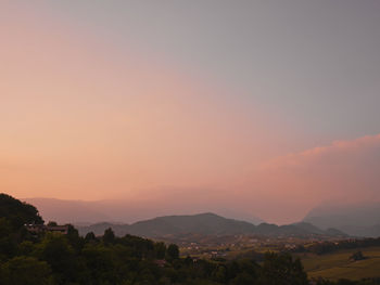 Scenic view of landscape against sky during sunset