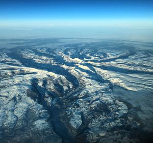 Aerial view of landscape against sky during winter