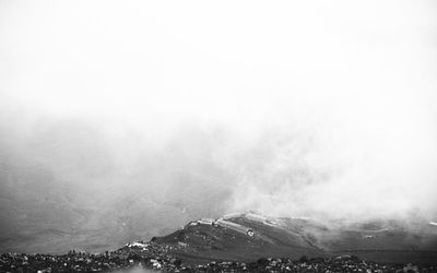 Scenic view of mountains against sky during winter