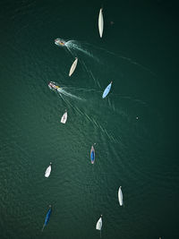 High angle view of people swimming in sea