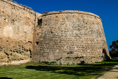 Low angle view of old ruins against clear sky