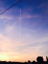 Low angle view of vapor trails in sky