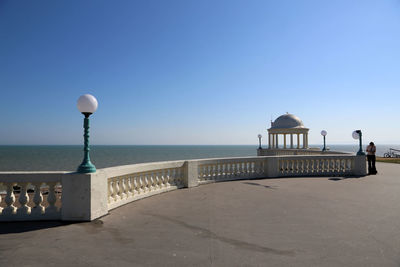 Lifeguard hut on beach against clear sky