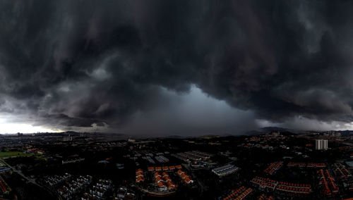 High angle view of cityscape against storm clouds