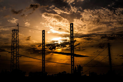 Silhouette trees against sky during sunset