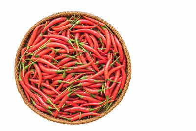 High angle view of red chili over white background