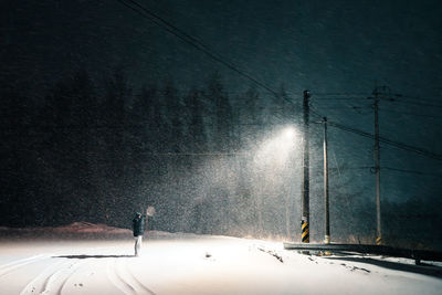 Low angle view of airplane against sky at night