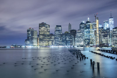 Manhattan glows across east river nyc