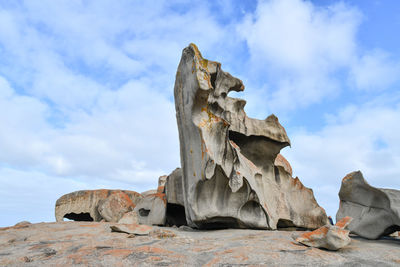 Low angle view of rock formation against sky