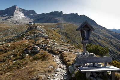 Built structure on land against mountains