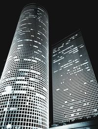 Low angle view of illuminated building at night