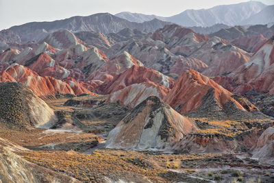 Aerial view of landscape with mountain range in background