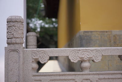 Close-up of sculpture against temple