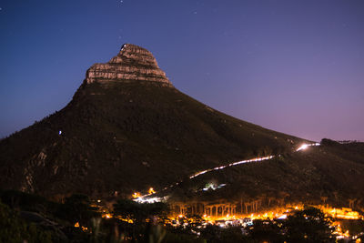 Houses in town on hill at night