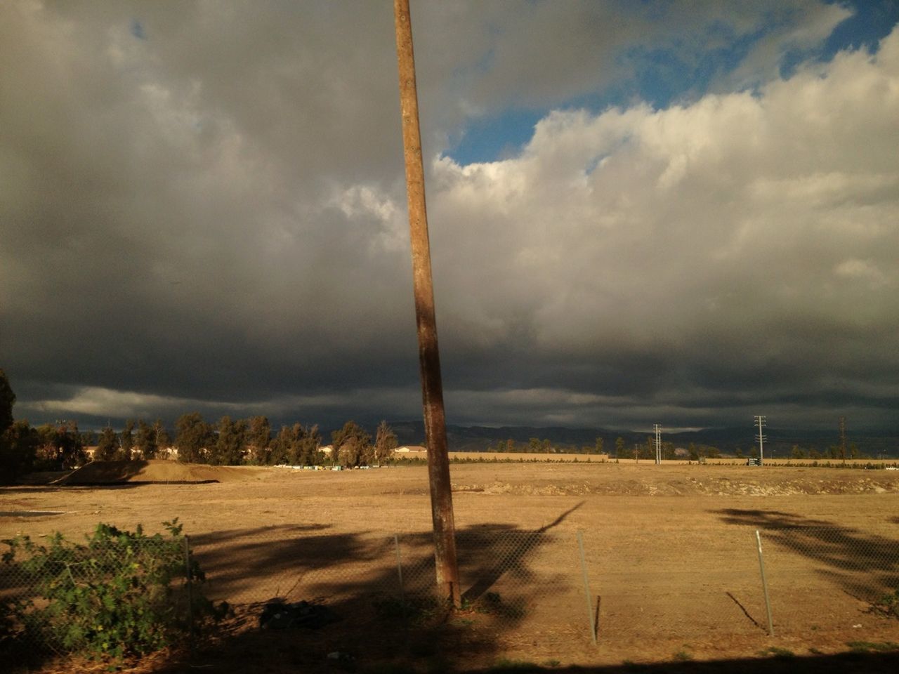 sky, cloud - sky, cloudy, weather, tranquility, overcast, tranquil scene, landscape, cloud, nature, tree, scenics, road, field, beauty in nature, outdoors, no people, storm cloud, day, non-urban scene