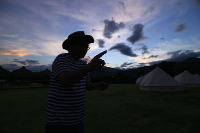 Side view of man looking at mountain