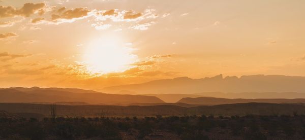 Scenic view of landscape against sky during sunset