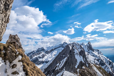 Panoramic view of snowcapped mountains against sky