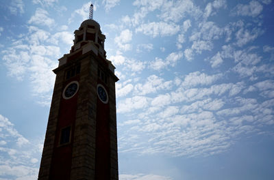 Low angle view of clock tower against sky